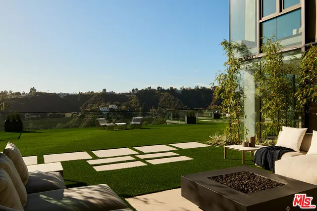 a view of a two chairs in a yard