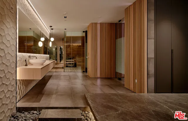 a room with gym equipment and mirror