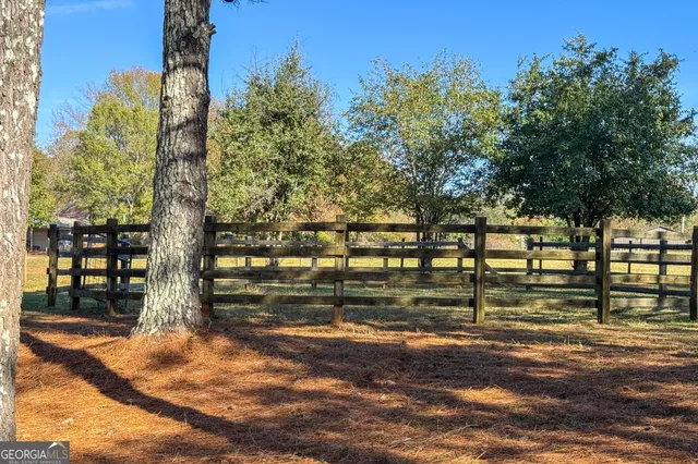 a view of a playground with basketball court