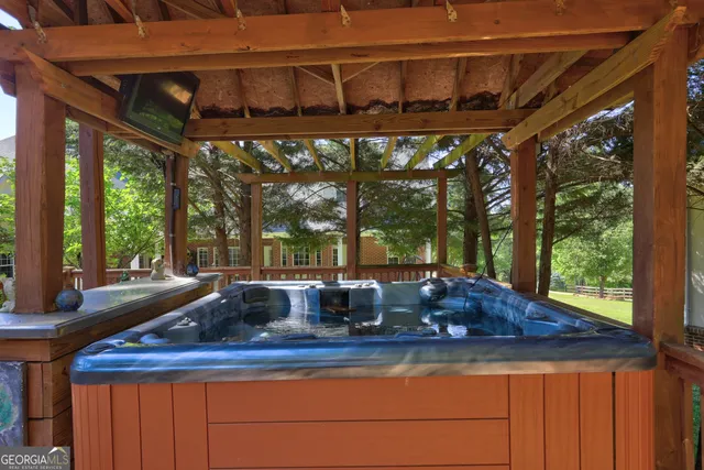 a blue sign that is sitting in front of a house with a small yard
