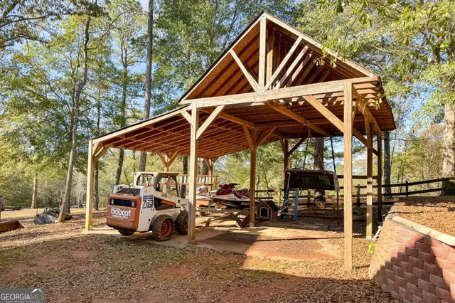 a view of a living room and chandelier fan