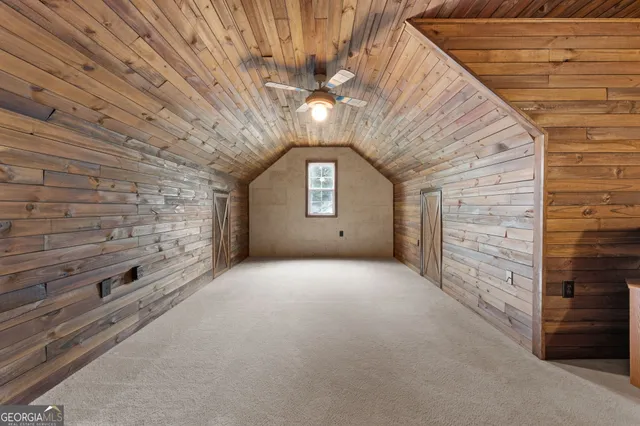 a view of a white house with a outdoor space