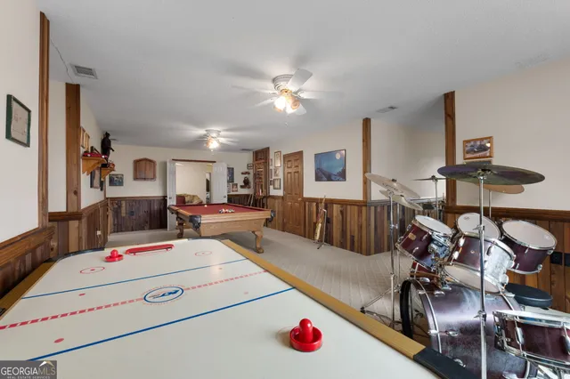 a bed sitting in a bedroom next to a large window