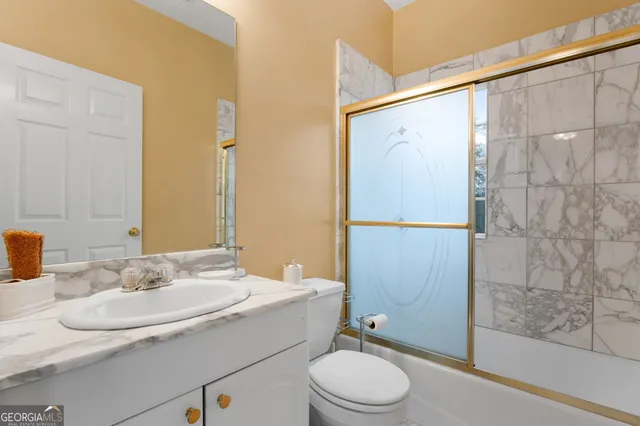 a view of a livingroom with a ceiling fan and window