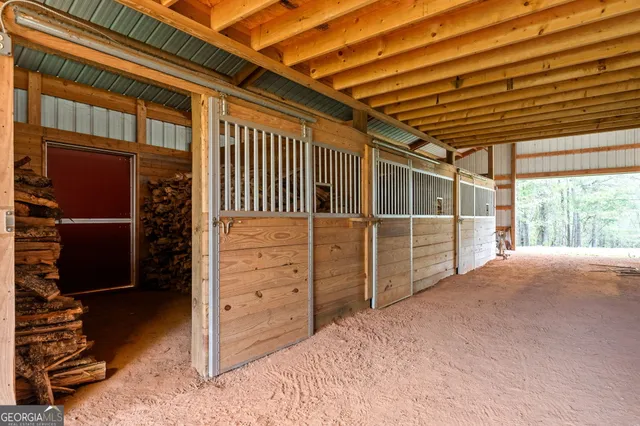 an aerial view of a house with a yard and large trees