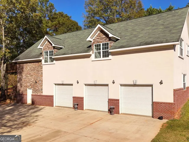 a view of a yard with large trees