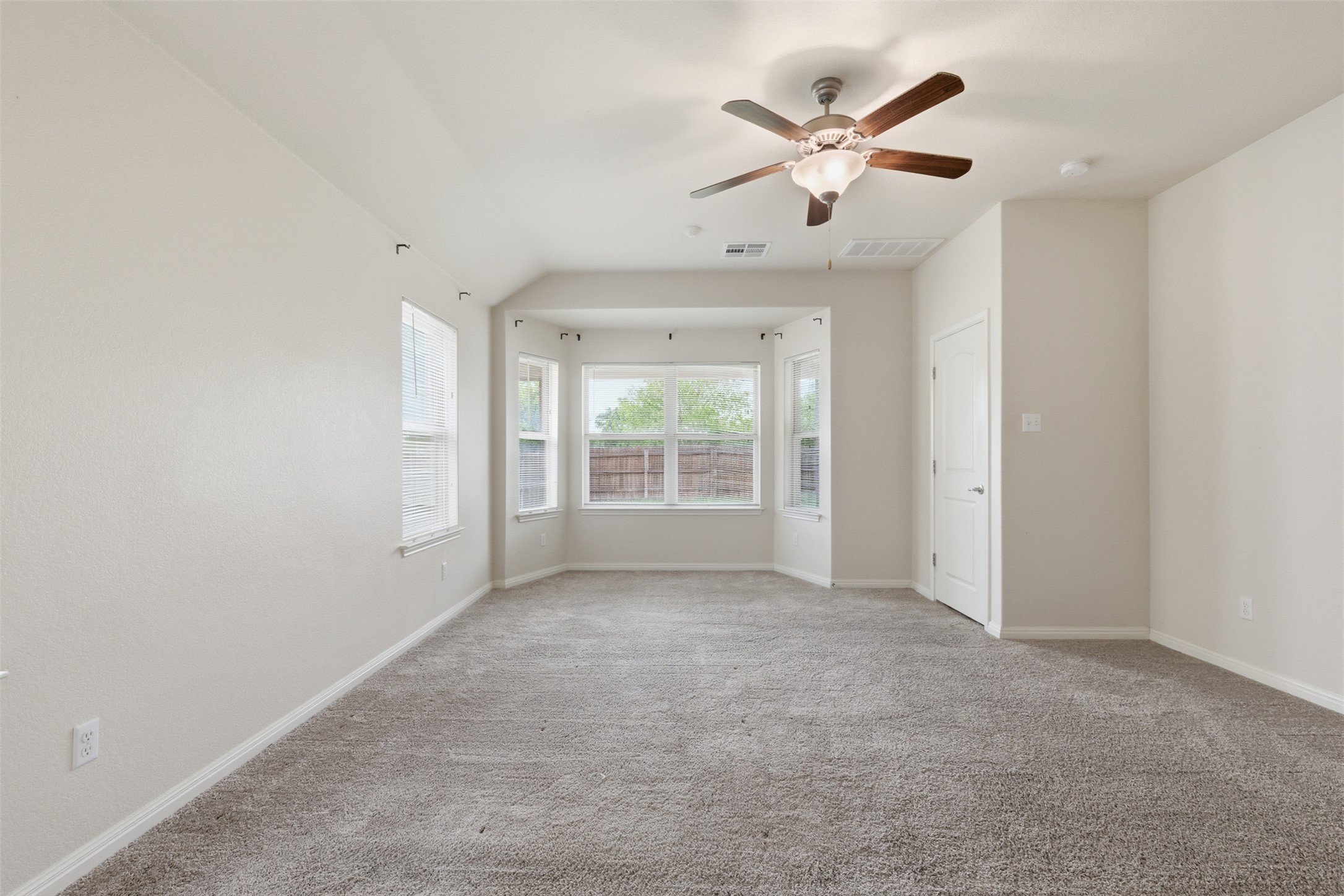 339 Sycamore Street Georgetown, TX 78633 - Photo 14 of 28 Carpeted spare room featuring a ceiling fan and baseboards