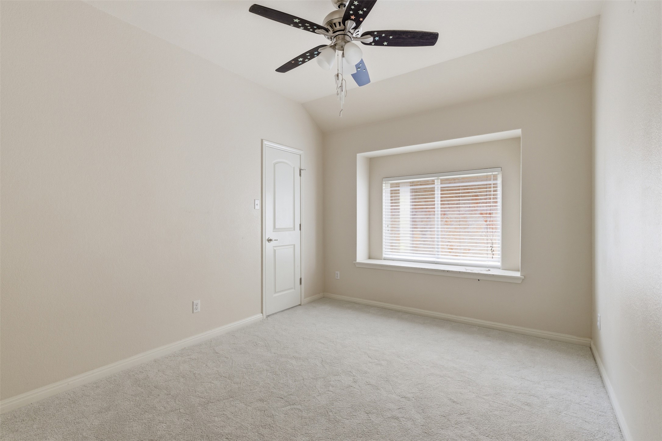 339 Sycamore Street Georgetown, TX 78633 - Photo 19 of 28 Unfurnished room with carpet flooring, lofted ceiling, and ceiling fan