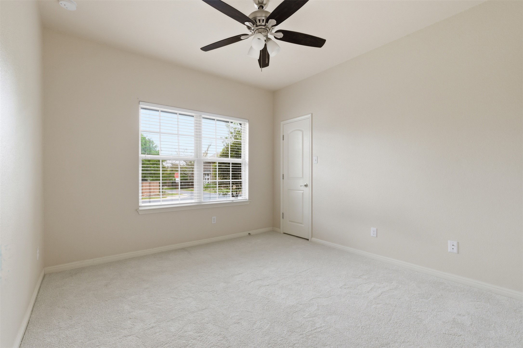 339 Sycamore Street Georgetown, TX 78633 - Photo 20 of 28 Unfurnished room featuring light carpet and ceiling fan
