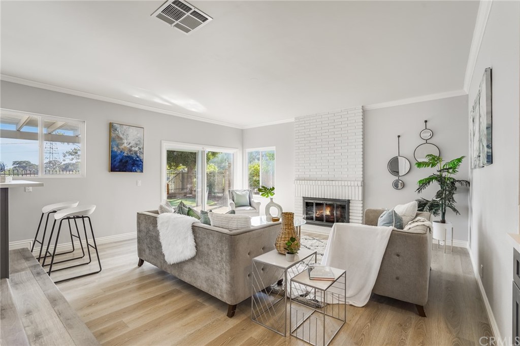 21626 Fairwind Lane Diamond Bar, CA 91765 - Photo 16 of 44 a living room with furniture a fireplace and a table