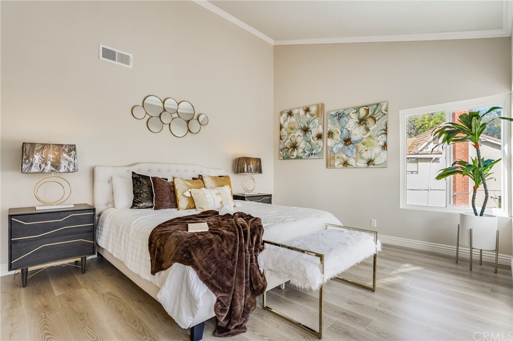 21626 Fairwind Lane Diamond Bar, CA 91765 - Photo 23 of 44 a bedroom with a bed and a couch