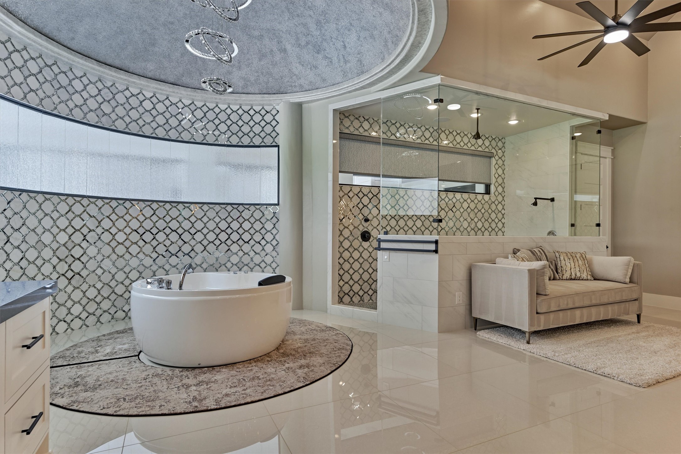 1907 Woerner Road Houston, TX 77090 - Photo 24 of 50 Beautiful marble and chrome accent tile surround the bath grotto area and walk-in shower. Soak in style in this round, jetted whirlpool tub.