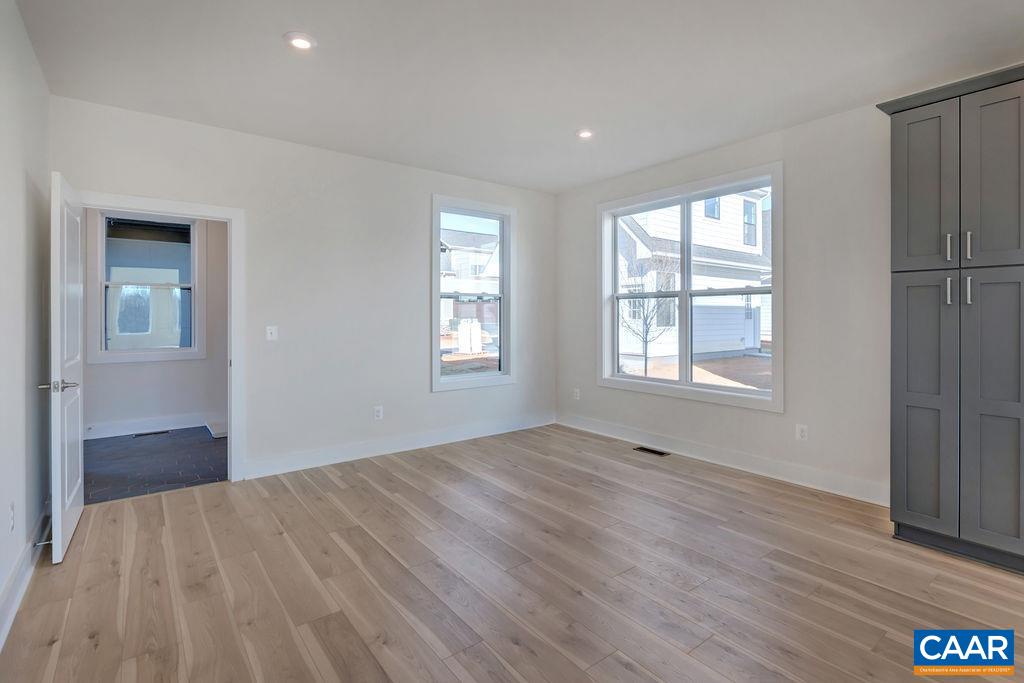 3254 Horizon Road Charlottesville, VA 22902 - Photo 13 of 32 a view of an empty room with wooden floor and a window