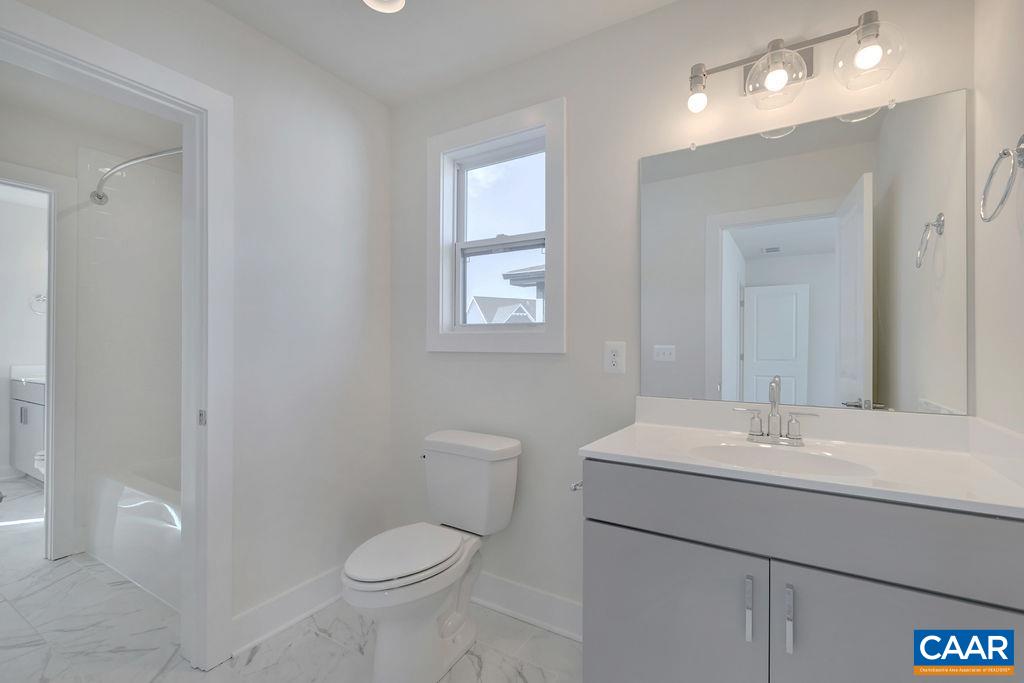 3254 Horizon Road Charlottesville, VA 22902 - Photo 22 of 32 a bathroom with a toilet sink and mirror