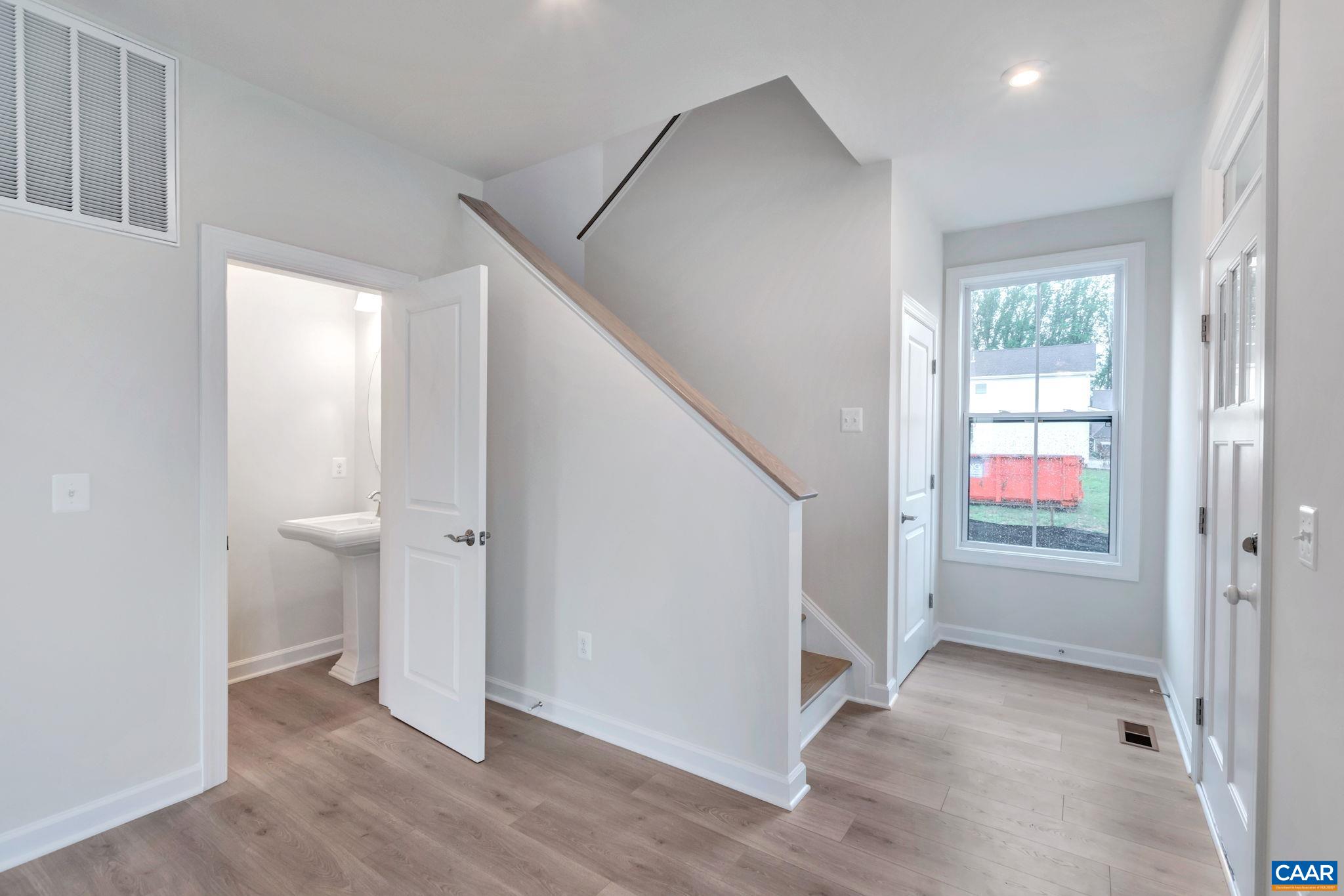 3254 Horizon Road Charlottesville, VA 22902 - Photo 5 of 32 a view of an empty room with window and wooden floor