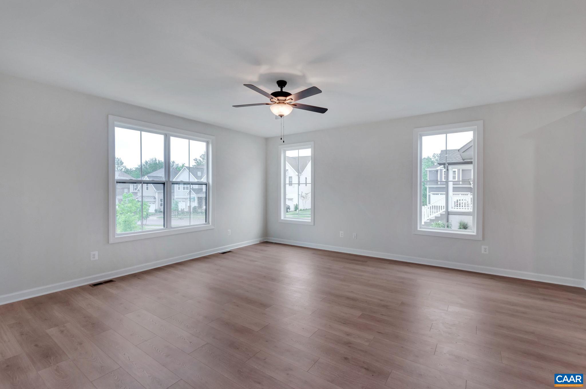 3254 Horizon Road Charlottesville, VA 22902 - Photo 6 of 32 a view of an empty room with wooden floor and a window