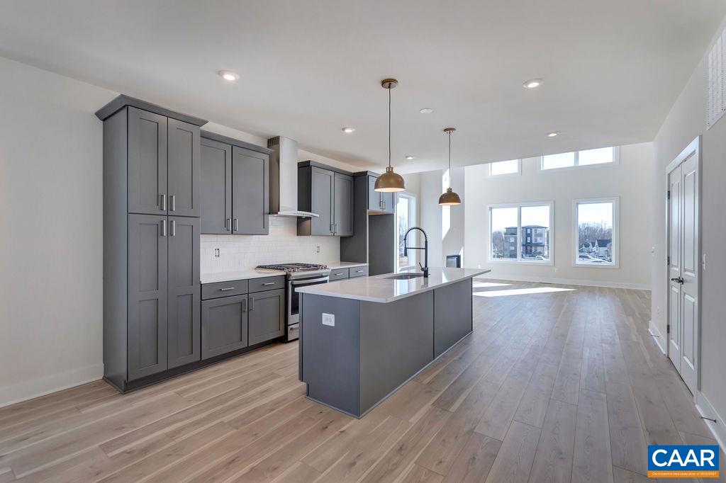 3254 Horizon Road Charlottesville, VA 22902 - Photo 10 of 32 a kitchen with kitchen island wooden floors appliances and cabinets