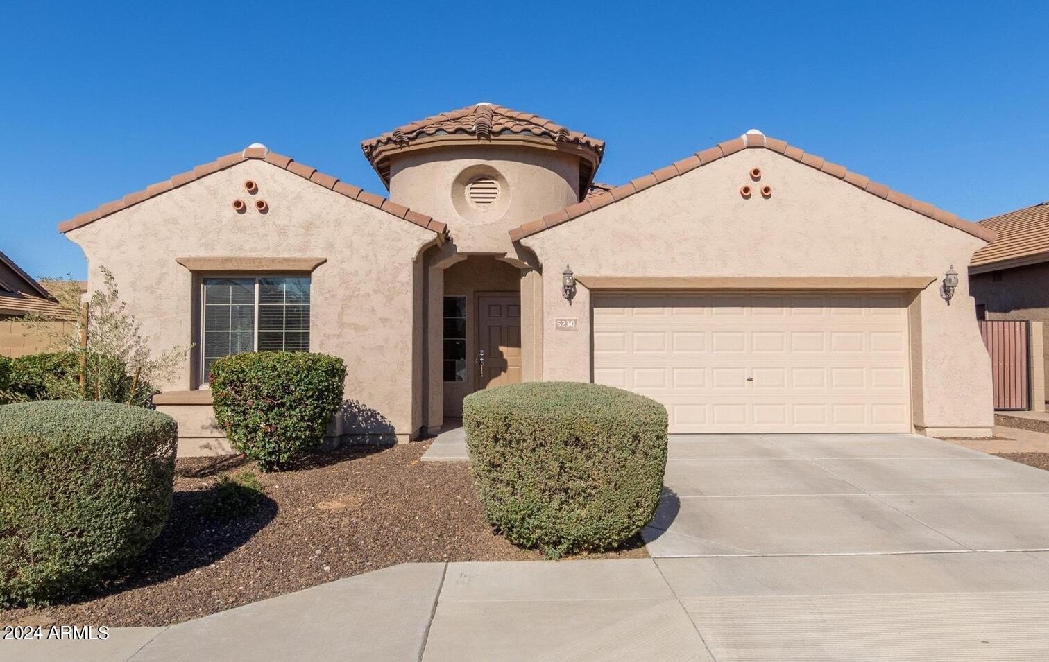 5230 West Red Bird Road Phoenix, AZ 85083 - Photo 1 of 26 a front view of a house with garden