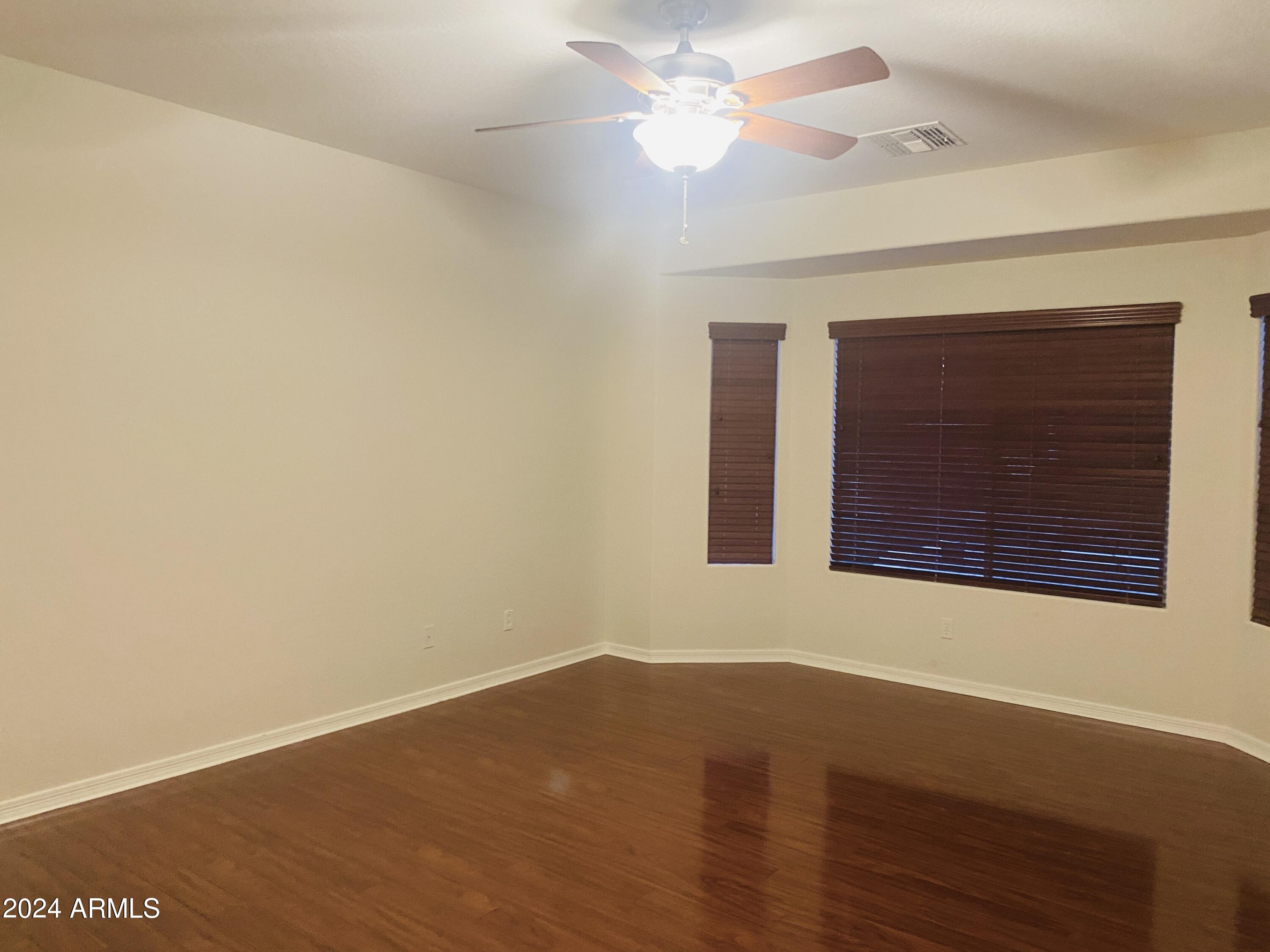 5230 West Red Bird Road Phoenix, AZ 85083 - Photo 11 of 26 an empty room with a window