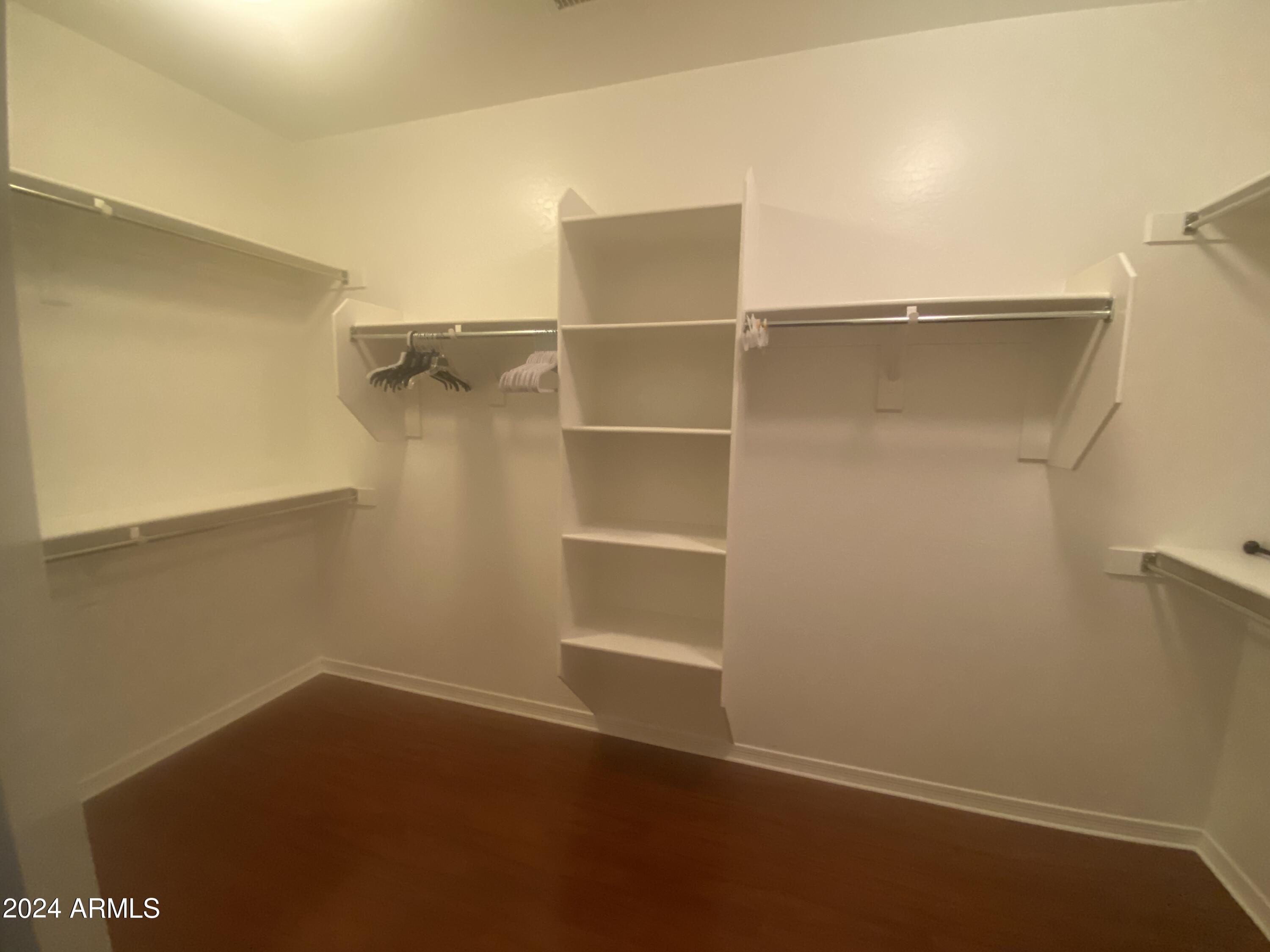 5230 West Red Bird Road Phoenix, AZ 85083 - Photo 13 of 26 a view of an empty walk in closet