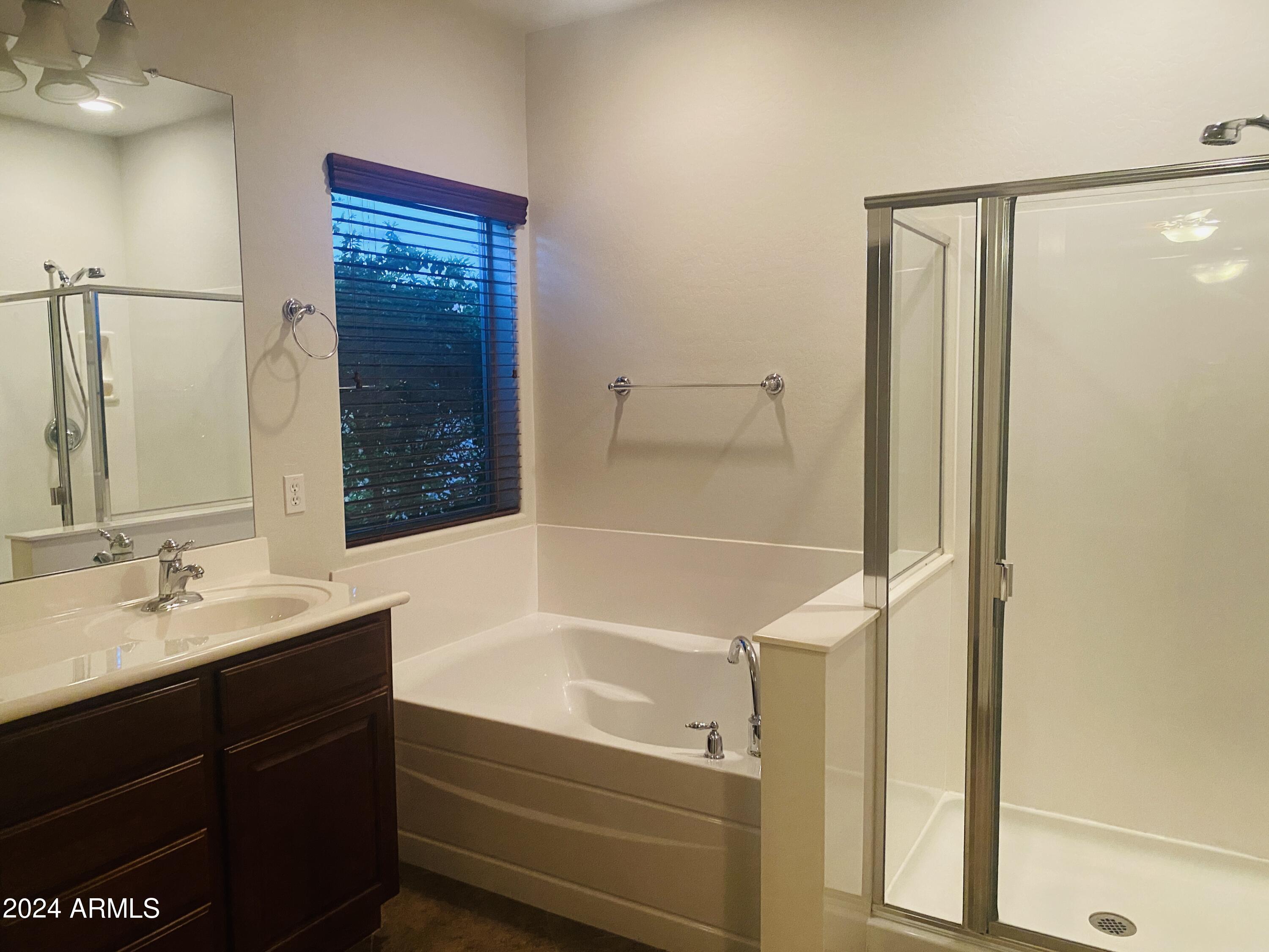 5230 West Red Bird Road Phoenix, AZ 85083 - Photo 14 of 26 a bathroom with a shower and a sink