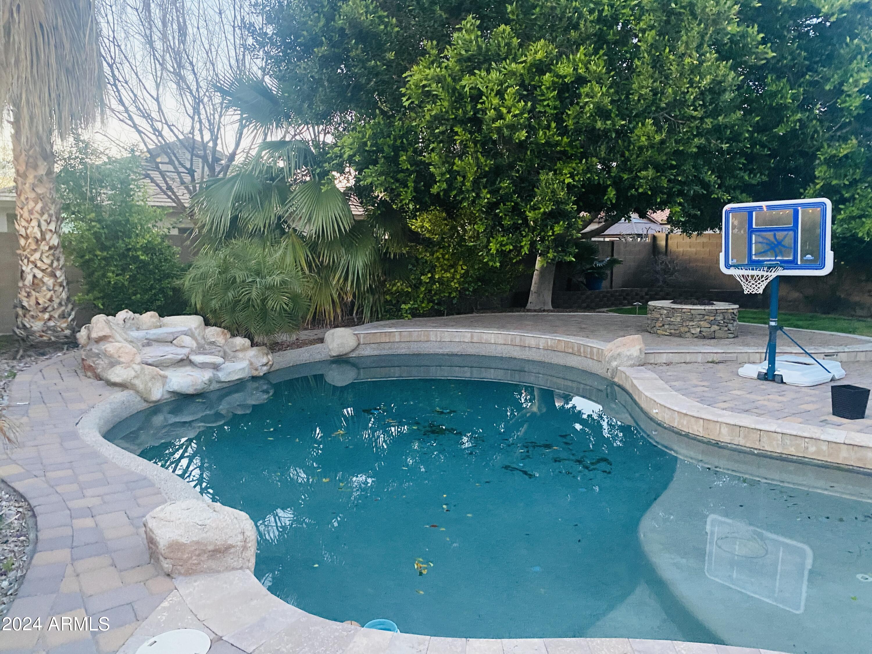 5230 West Red Bird Road Phoenix, AZ 85083 - Photo 18 of 26 a swimming pool with a yard
