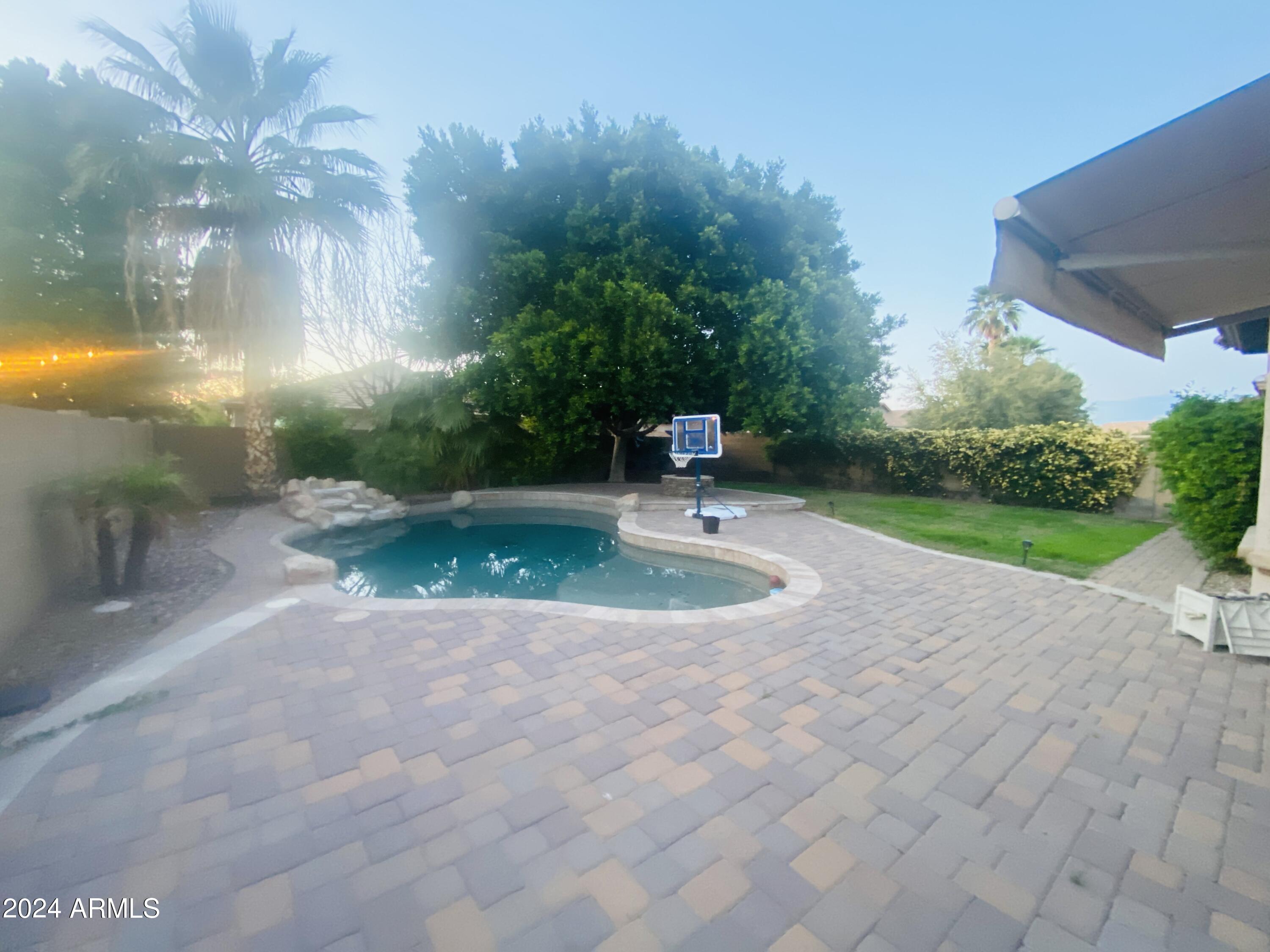 5230 West Red Bird Road Phoenix, AZ 85083 - Photo 21 of 26 a view of a fountain in front of a house