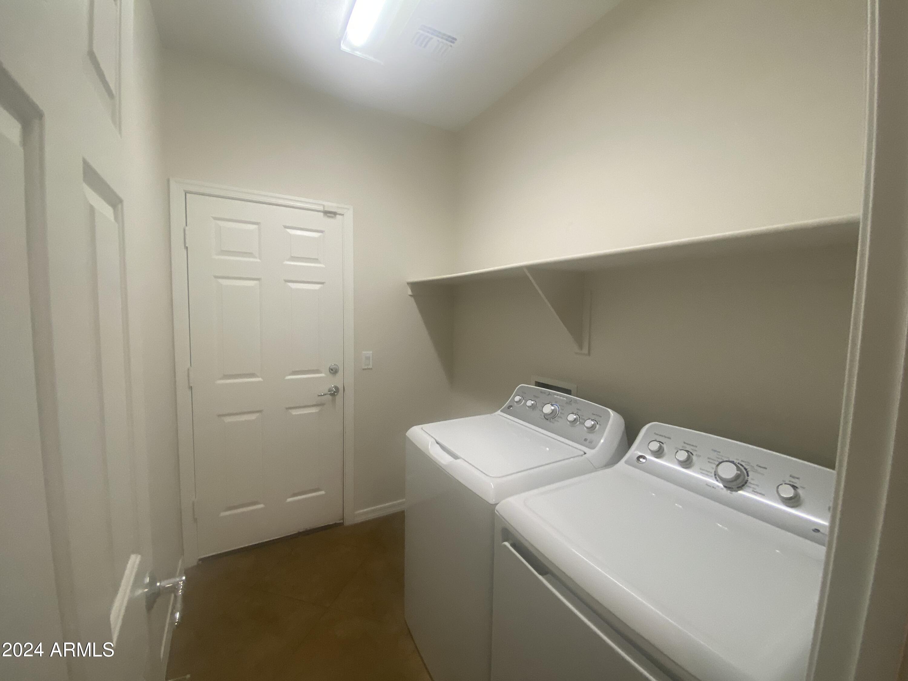 5230 West Red Bird Road Phoenix, AZ 85083 - Photo 8 of 26 a utility room with dryer and washer