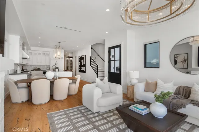 a kitchen with stainless steel appliances a sink stove and cabinets