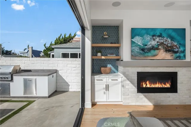 a kitchen with stainless steel appliances kitchen island granite countertop a table and chairs in it