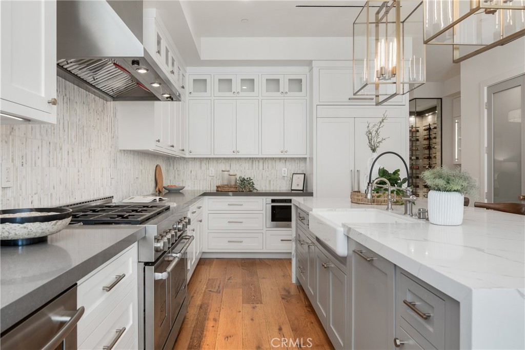 1004 Huntington Street Huntington Beach, CA 92648 - Photo 14 of 46 a kitchen with stainless steel appliances a sink stove and cabinets