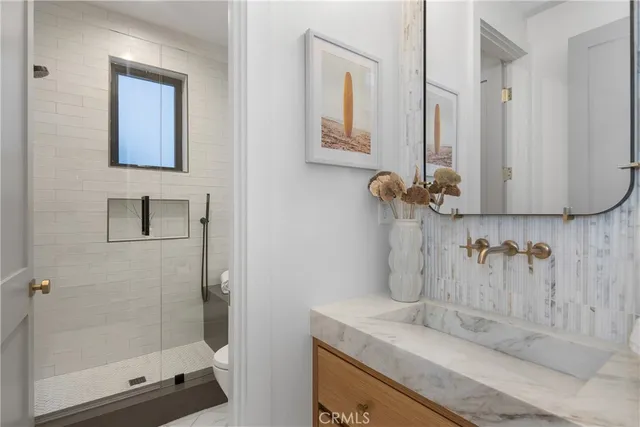 a bedroom with a bed and a fireplace