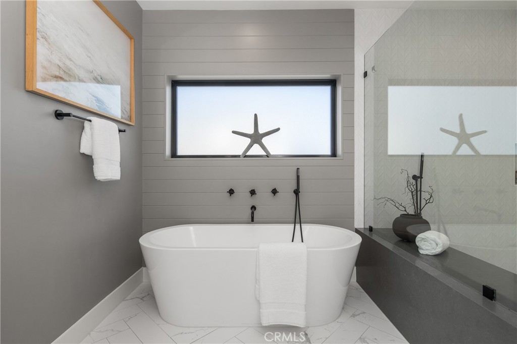 1004 Huntington Street Huntington Beach, CA 92648 - Photo 25 of 46 a white bath tub sitting in a bathroom