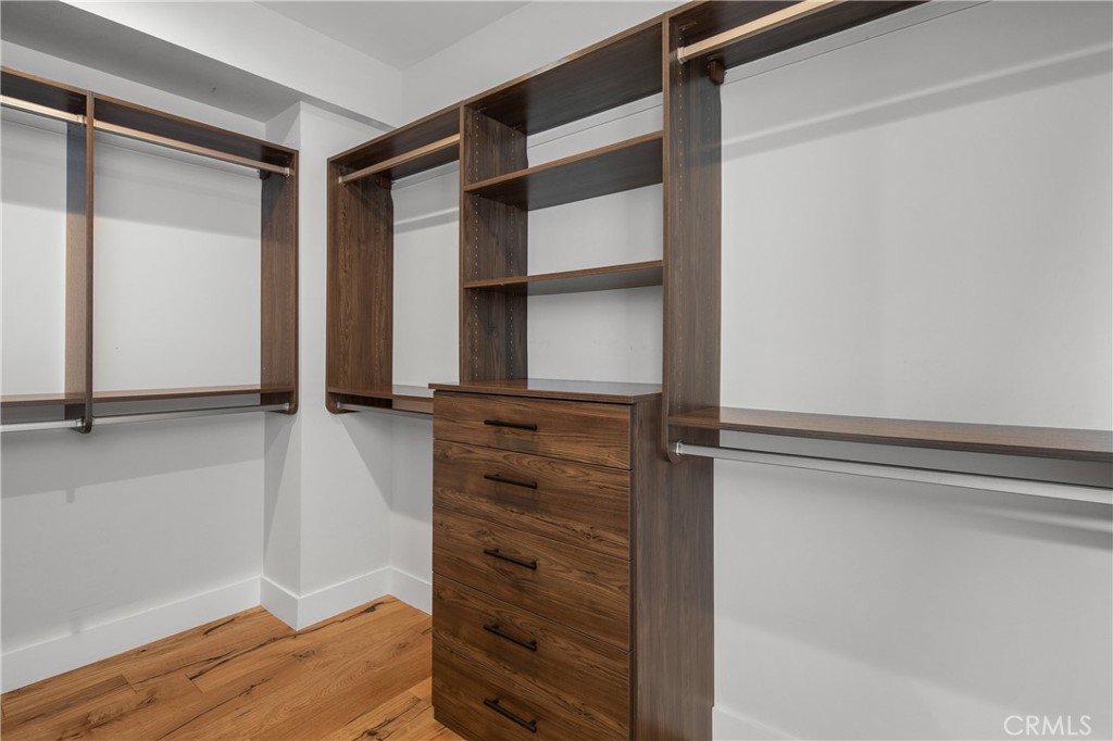 1004 Huntington Street Huntington Beach, CA 92648 - Photo 28 of 46 a view of walk in closet with empty racks