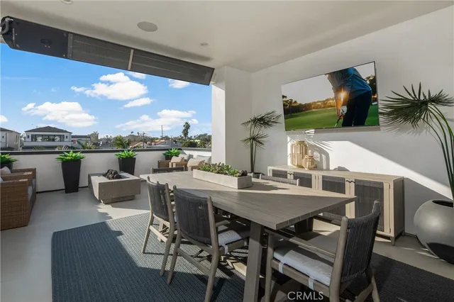 a terrace view with seating space and barbeque oven