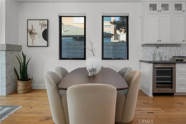a living room with furniture a table and a chandelier
