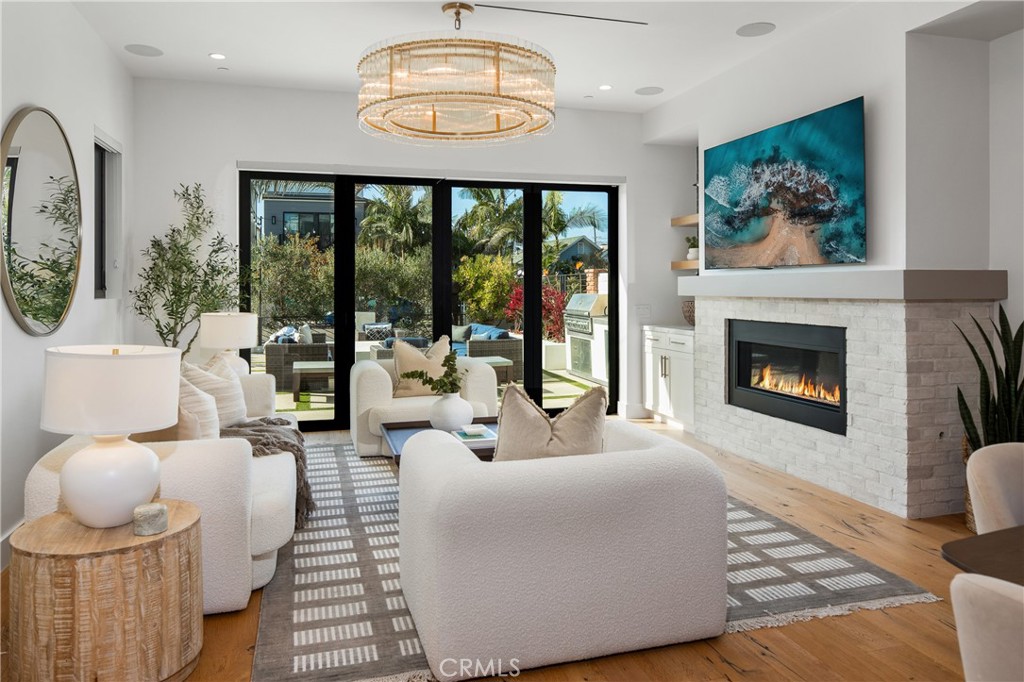 1004 Huntington Street Huntington Beach, CA 92648 - Photo 9 of 46 a living room with furniture and a fireplace