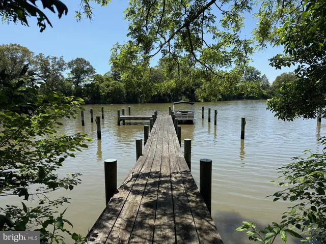 an aerial view of a house with a lake view