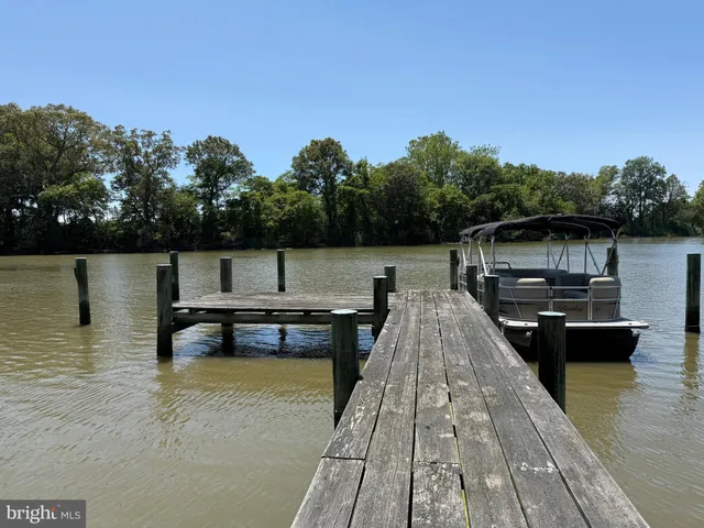 an aerial view of a golf course with parking space