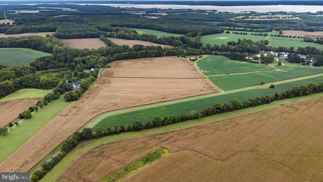 a large kitchen with stainless steel appliances a stove a sink and a refrigerator