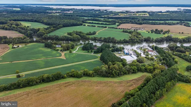 a bathroom with a granite countertop sink toilet a shower and a mirror