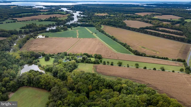 a spacious bathroom with a granite countertop sink mirror and a