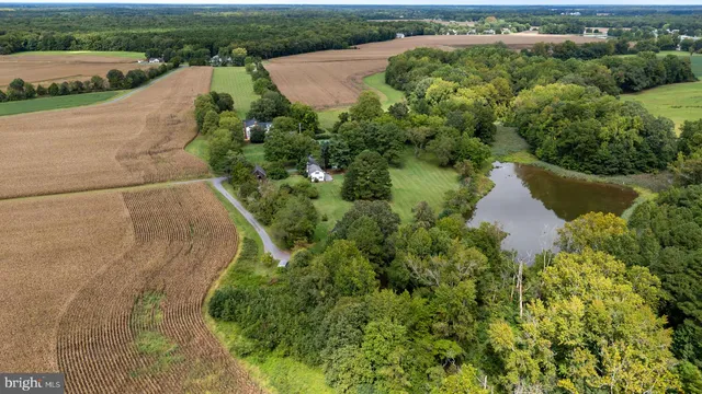 a view of staircase with railing and white walls