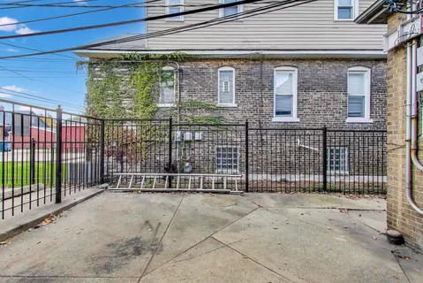 a view of a house with a iron gate