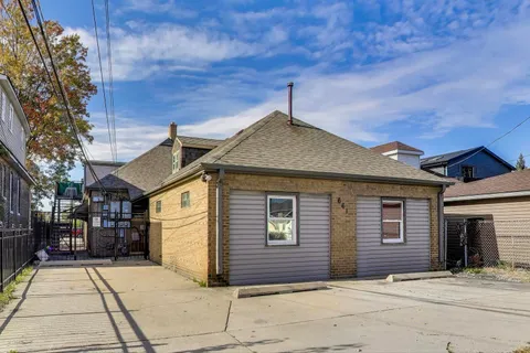 a front view of a house with yard