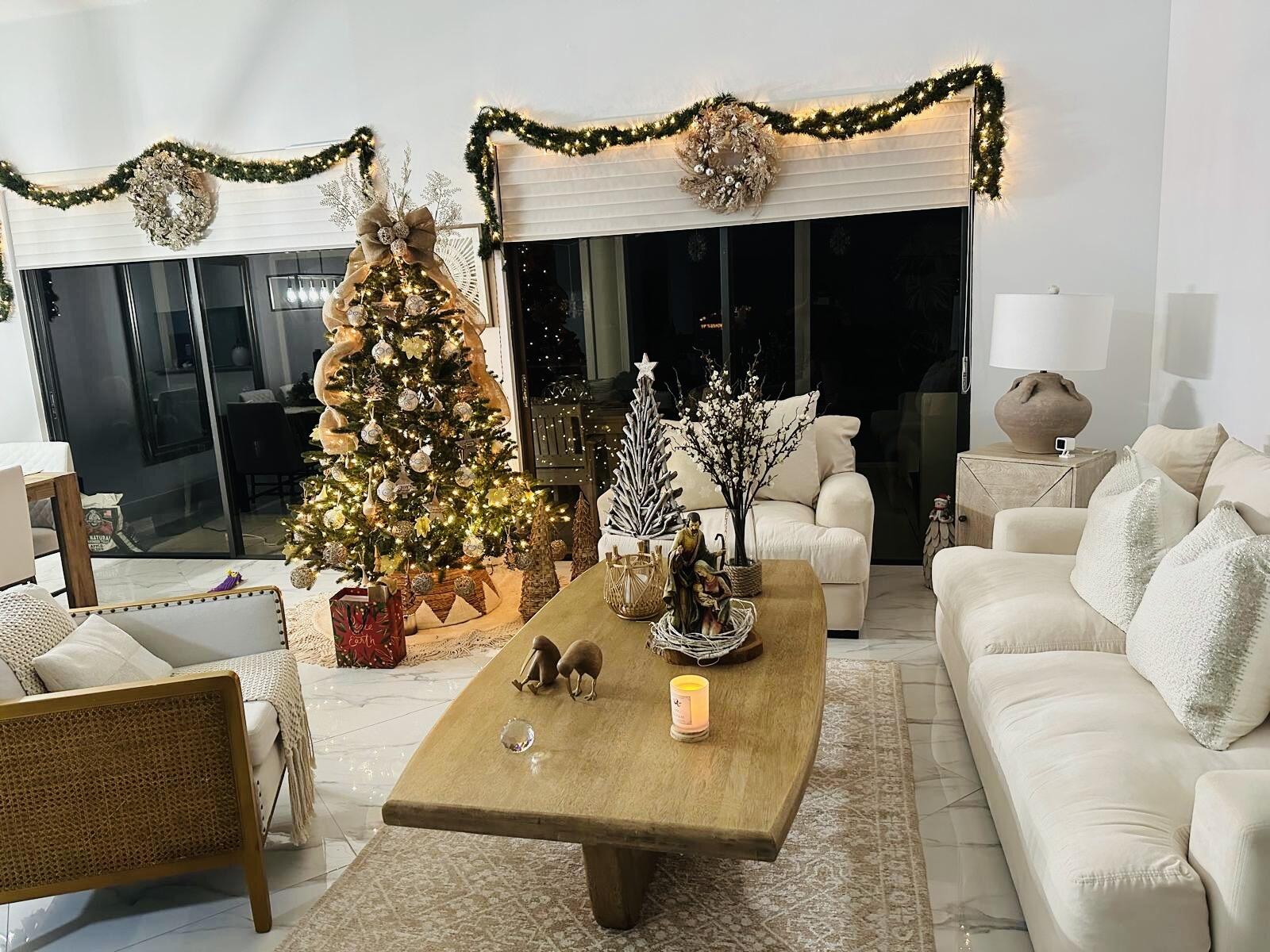 18266 Covina Way, Unit 201 Boca Raton, FL 33498 - Photo 1 of 6 a living room with furniture a chandelier and a fireplace