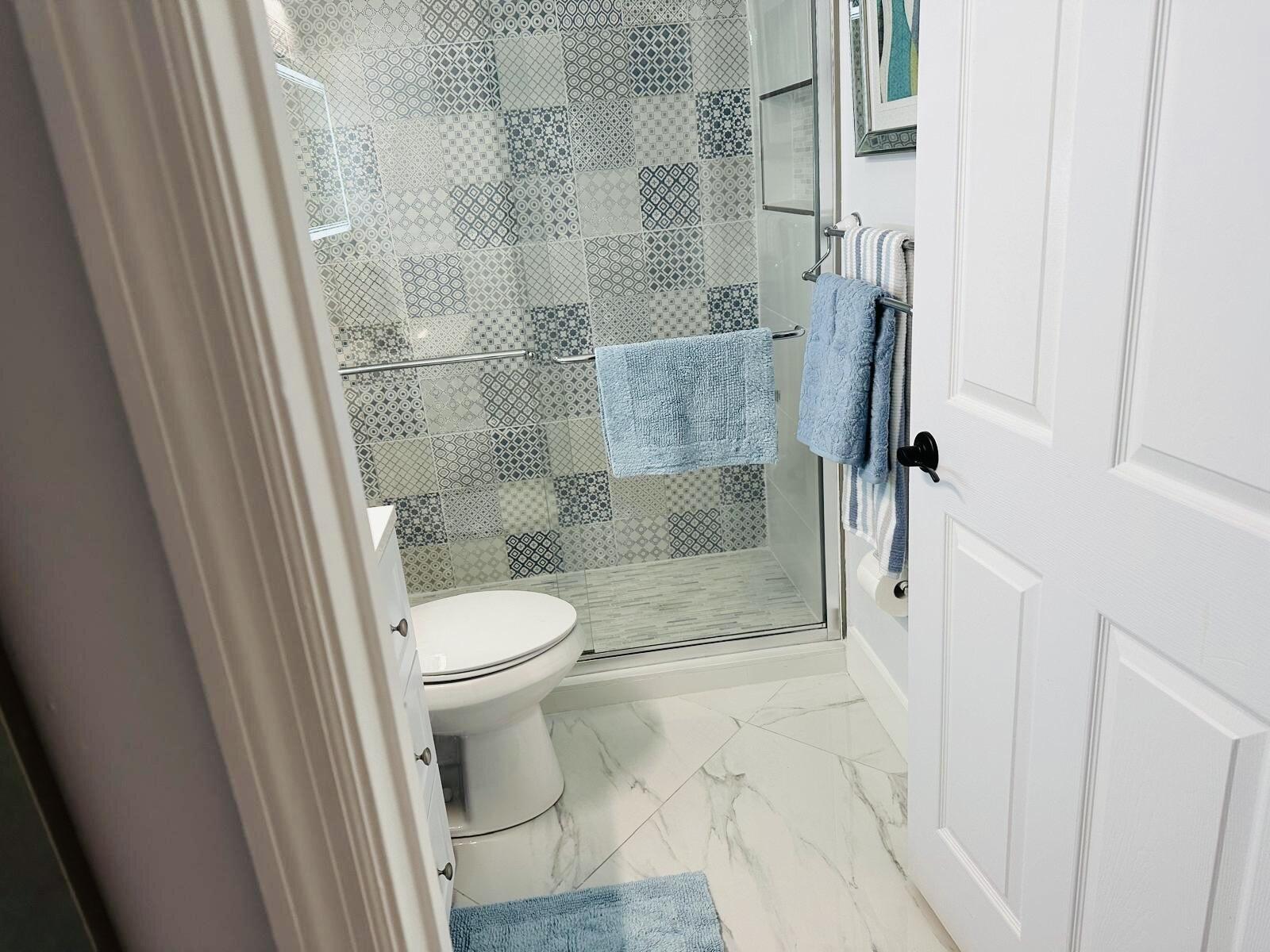 18266 Covina Way, Unit 201 Boca Raton, FL 33498 - Photo 6 of 6 a bathroom with a toilet and a shower