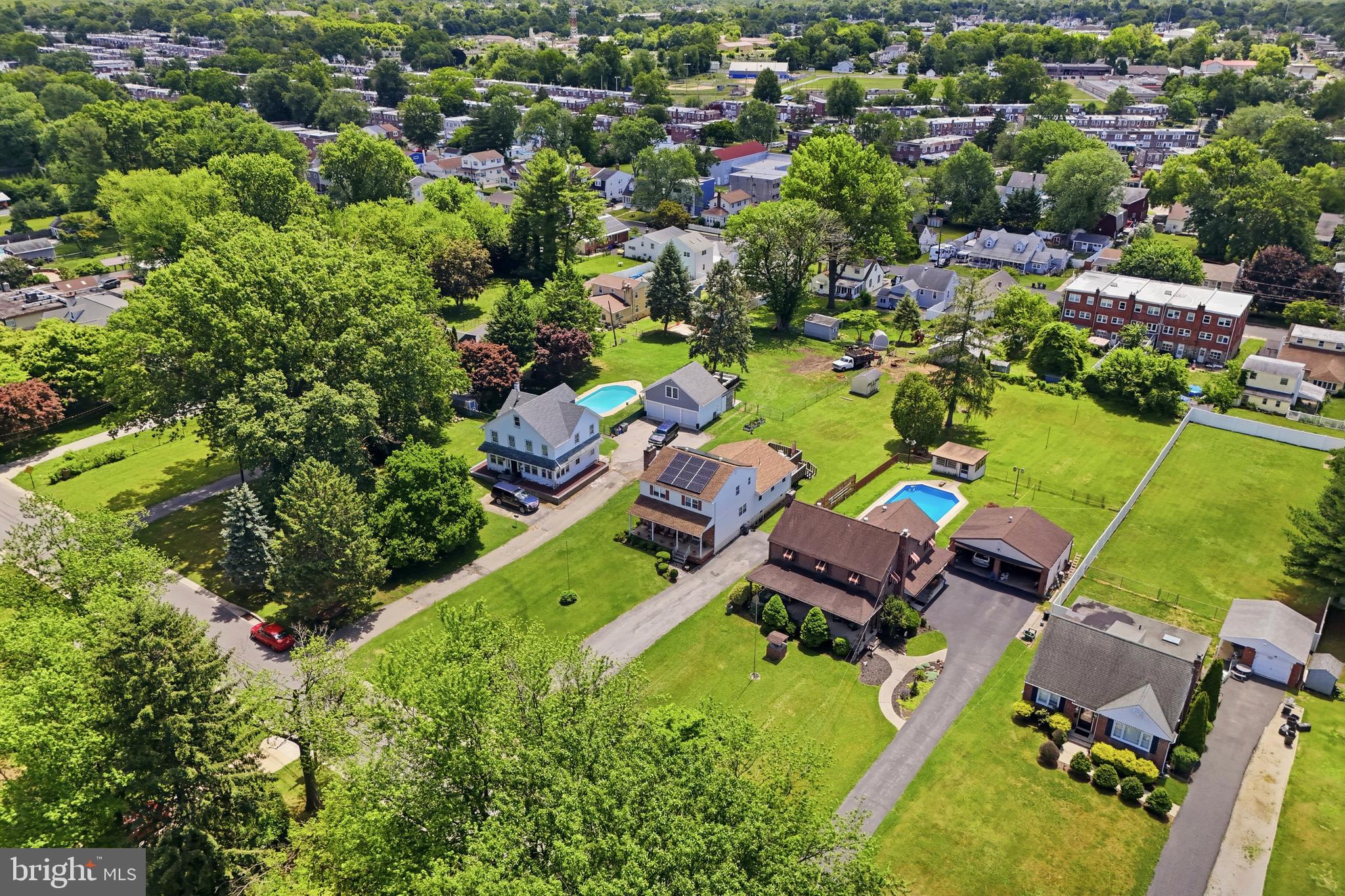 1004 Green Lane Secane, PA 19018 - Photo 39 of 49 an aerial view of a house with a garden and swimming pool