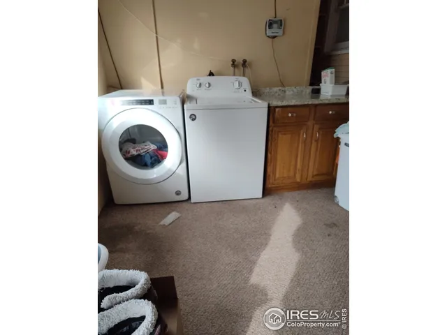 a view of a room with a table and a chair