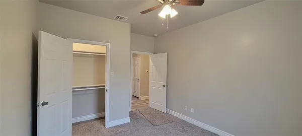 an empty room with a bathroom